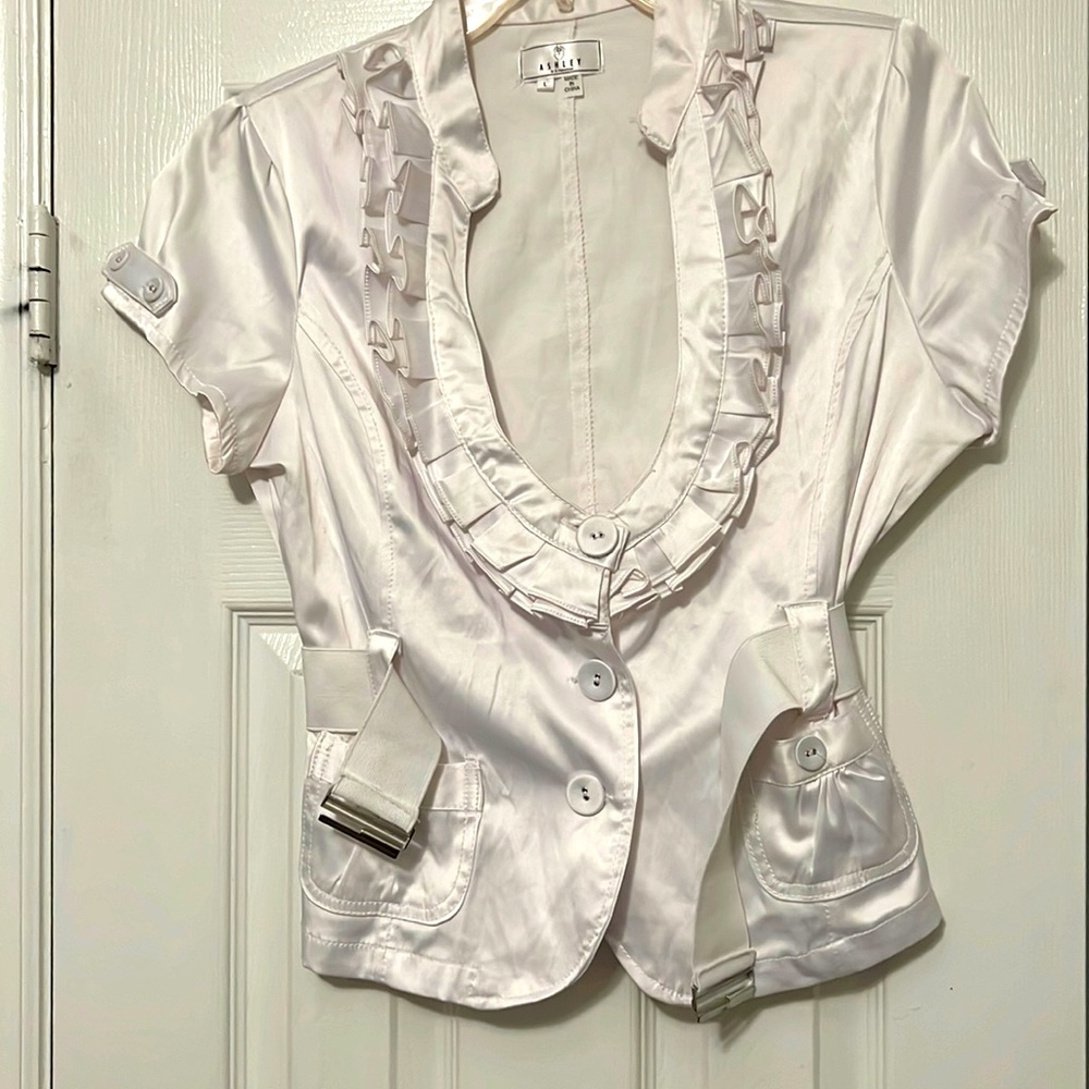 New white top with white and silver belt